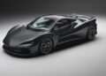 A sleek black supercar inspired by the Lanzante 95-59, with aerodynamic curves and low-profile tires, is parked in a studio with a plain background, evoking the spirit of Le Mans legends like the McLaren F1 GTR.