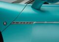Close-up of a turquoise 2026 Maserati MCPURA door featuring the "MC PURA" badge and part of the side mirror, debuting at Goodwood with a liquid crystal roof and F1 tech.