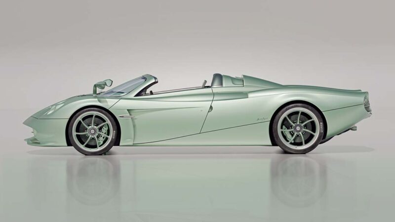 A sleek, light green Pagani Huayra Codalunga convertible sports car is shown in side profile against a plain, light background, highlighting this stunning limited edition model.
