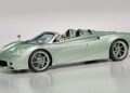 A light green Pagani Huayra Codalunga luxury convertible sports car with two seats, shown against a plain, light background. This limited edition masterpiece showcases the exclusivity of Pagani Automobili.