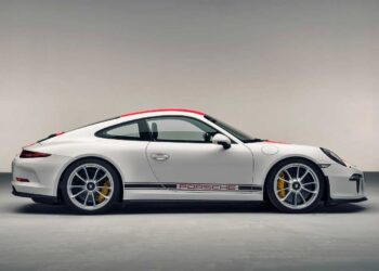 A white Porsche 911 S/T sports car with red accents and "Porsche" branding on the side, shown in profile view against a plain background—the next best thing to owning a $500k classic.