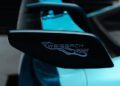Close-up of a car’s side mirror with the “Weissach RS” logo printed on it; the mirror and car are painted in PTS Ipanema Blue, highlighting this stunning 911 GT3 RS at Porsche Exchange.