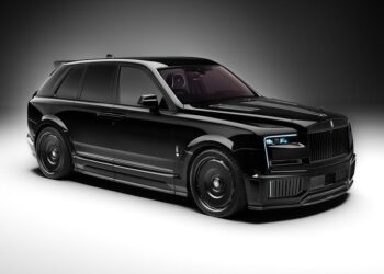 A black Rolls-Royce Cullinan luxury SUV with tinted windows, carbon fiber widebody, 24-inch black rims, and blue accent headlights is parked on a plain white background.