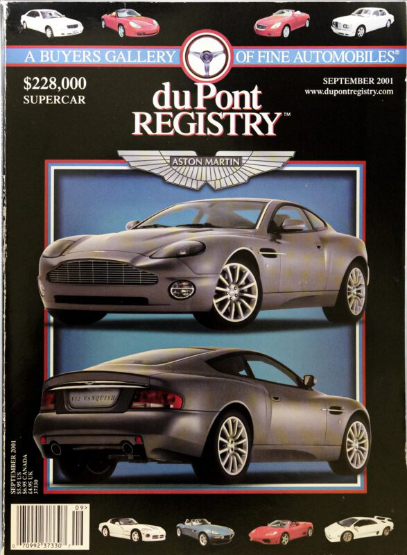 Cover Cars: 2001 duPont REGISTRY magazine featuring two views of a grey Aston Martin Vanquish, priced at $228,000, with other car images and magazine details at the top. Celebrating the 40th Anniversary in style.