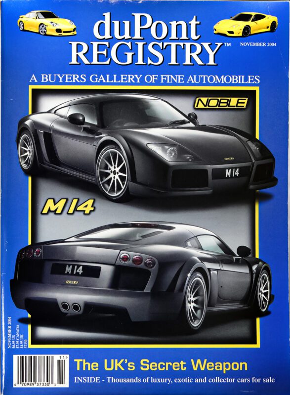 Blue duPont REGISTRY magazine cover from November 2004 featuring two images of a black Noble M14 sports car, highlighted as "The UK's Secret Weapon," celebrating standout Cover Cars.