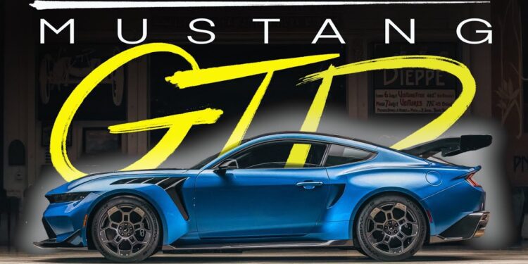 A blue Ford Mustang GTD parked indoors, viewed from the side, with bold text "MUSTANG GTD" displayed above the car—just like one Jay Leno might showcase in his legendary garage.