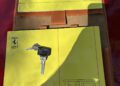 A Ferrari F40 owner's warranty and service book, manual, and two keys are displayed on a brown leather case—an essential set for any collector looking to auction or buy now.