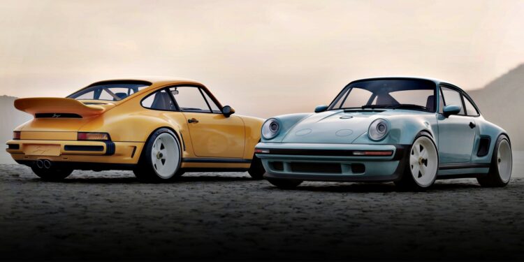 Two classic Porsche 911 cars, reimagined by a California-based singer, sit side by side—one yellow, one light blue—unveiled as the latest Carrera Coupes at Goodwood against a hazy sky backdrop.