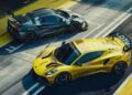 Two Lotus race cars, one yellow and one grey with yellow accents, are parked side by side on a racing track as Lotus prepares to honor F1 legends Senna and Clark at Goodwood.