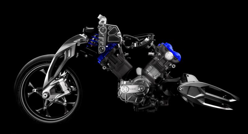 A motorcycle chassis is shown with exposed components, including the engine, front suspension, wheel, and frame, featuring Brough Superior engineering and RMB01 precision, isolated on a black background.