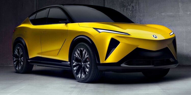A yellow all-electric SUV with black accents is parked indoors against a gray concrete wall, showcasing sleek lines and modern design features inspired by Monterey style and Acura RSX influences.
