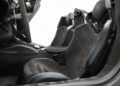 Only 10 in the U.S.: Lamborghini Centenario Roadster hits the market, boasting an exclusive interior with two black sports seats, blue trim, and striking carbon fiber details.