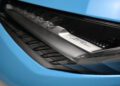 Close-up of a blue car’s headlight with “Lamborghini Light Design” branding visible inside the lens. Only 10 in the U.S.: Lamborghini Centenario Roadster hits the market, making this exclusive detail even more striking.