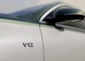 Close-up of the Mercedes-Maybach S 680’s side panel, featuring a “V12” badge and part of a side mirror, hints at this limited edition model’s powerful V12 engine and exclusivity.