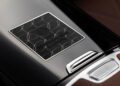 Close-up of a black and silver badge on a car interior, displaying a geometric pattern and text reading "Everest EBX 1 of 25," highlighting its limited edition exclusivity.