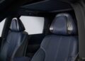 Front view of two blue leather car seats with white stitching and metallic trim inside a vehicle, showcasing part of the interior door and roof—the 2026 INFINITI QX80 Introduces SPORT Grade that ups the luxury game.