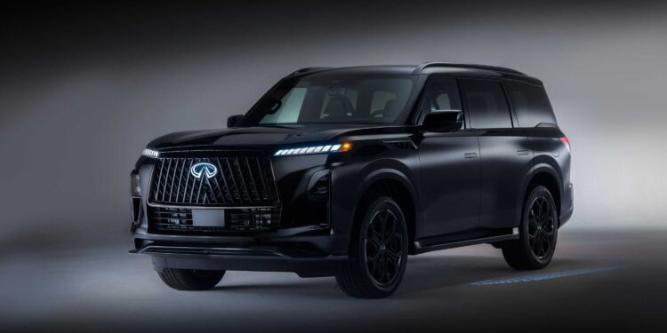 A black 2026 INFINITI QX80 SPORT Grade luxury SUV is parked in a studio setting, with soft lighting highlighting its front and side, truly upping the luxury game.