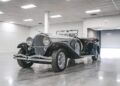 A million-dollar car parked in a garage, ready for its grand debut at the Mecum Monterey 2025 auction.