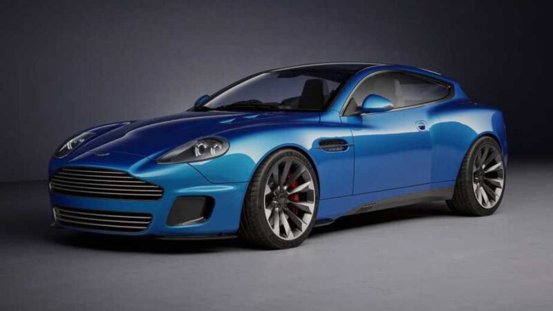 A blue Callum Design sports car with a sleek, aerodynamic build is parked indoors on a plain gray surface, photographed from the front driver's side.