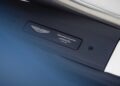 Close-up of an Aston Martin plaque reading "THRILLSEEKER COLLECTION - 1 OF 25 UNITS" on a car interior panel, celebrating Aston Martin marking 75 years in the Americas with the exclusive Thrillseeker Collection.