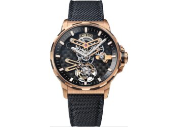 A rose gold skeleton wristwatch with a black textured strap, visible gears and mechanisms, and the brand name Angelus on the dial—a standout choice among the best luxury watches.