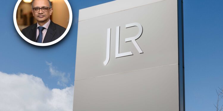 A photo of Adrian Mardell in a suit within a circular frame is overlaid on an image of a tall sign with the JLR logo, set against a blue sky with clouds.