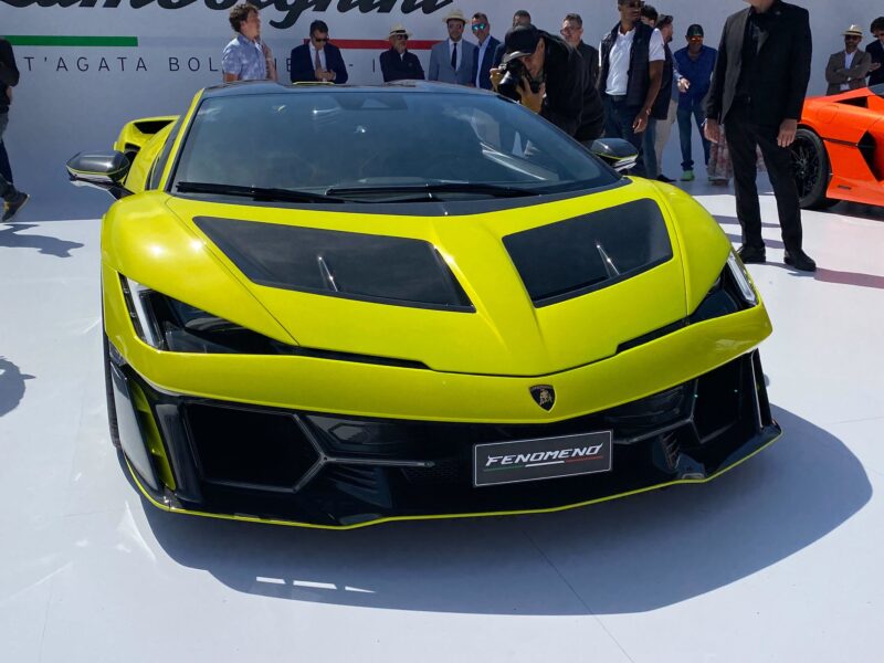 A bright green Lamborghini Fenomeno on display outdoors, surrounded by people and viewed from the front, as excitement builds following the Ferrari F50 GT1 being crowned Best of Show at The Quail, A Motorsports Gathering 2025.