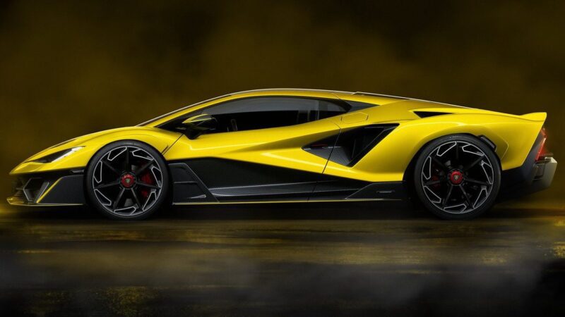 A yellow Lamborghini Fenomeno: Limited-Run V12 Masterpiece Unveiled at Monterey, is shown in profile view, featuring sharp angles, large black wheels, and a low, aerodynamic design against a dark background.