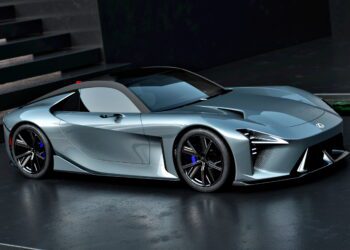 A sleek, silver Lexus Sport Concept debuts at Pebble Beach, parked on a dark surface with black accents, sharp lines, a low profile, and distinctive LED headlights.