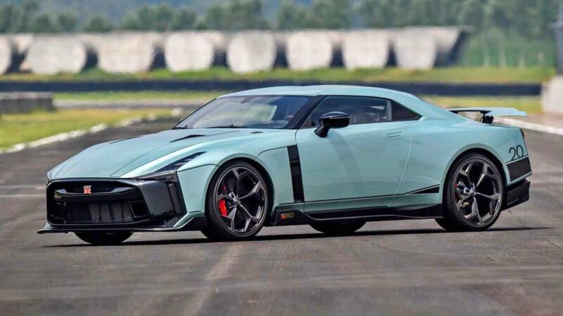 A light blue Nissan R35 GT-R sports car parked on a racetrack, featuring black accents, large wheels, and a rear spoiler—an icon marking the end of an era.