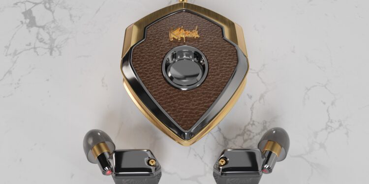 Brown and gold shield-shaped case with a central dial, flanked by two black and gold wireless earbuds—perfect luxury accessories displayed on a white marble surface.
