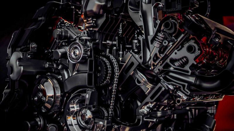Close-up view of an intricate internal combustion engine in a Pininfarina AI-engineered hypercar, showcasing gears, chains, and various mechanical components—perfect for Miami’s vibrant automotive scene.