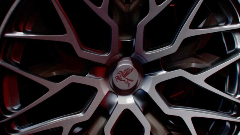 Close-up of a silver alloy wheel with an intricate spoke design and a Pegasus logo on the center cap, featured on an AI-engineered hypercar inspired by Pininfarina in vibrant Miami.