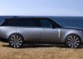 A one-off Range Rover SV Asilomar parked on dry grass near a coastline, with the ocean and blue sky in the background.