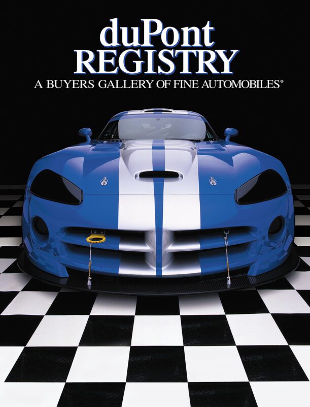 A blue and white sports car on a black and white checkered floor celebrates the duPont REGISTRY 40th Anniversary, with the magazine's title at the top—a true Cover Cars standout.