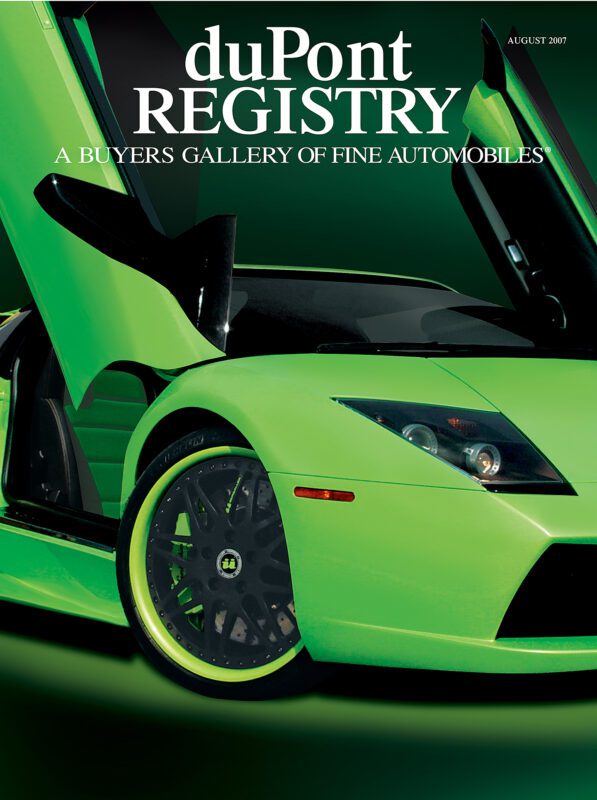 Cover Cars: duPont REGISTRY 40th Anniversary edition features a striking green sports car with scissor doors open, showcasing its front wheel and headlight against a vibrant green background.