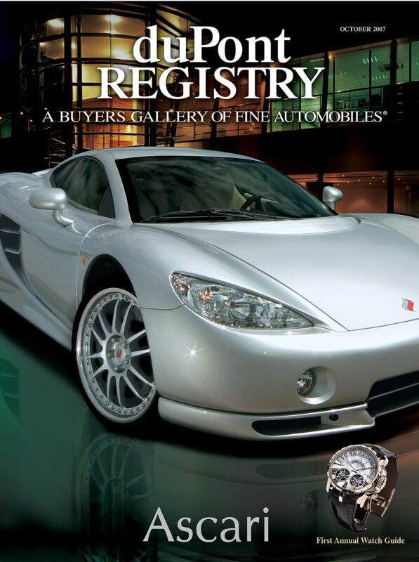 A silver Ascari sports car graces the duPont REGISTRY Cover Cars issue, October 2007, with a stylish watch featured in the lower right corner.