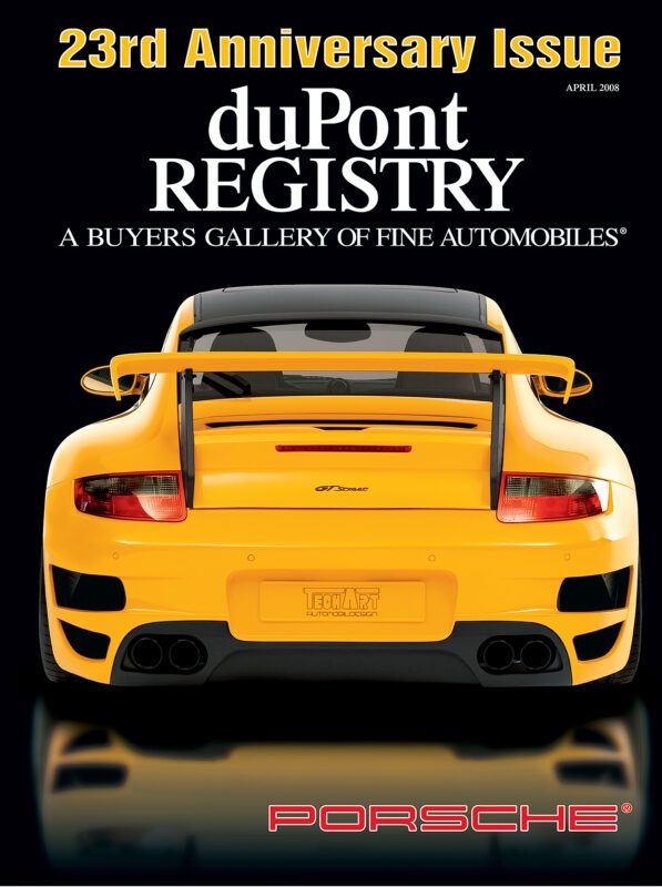 Rear view of a yellow Porsche sports car with a large spoiler featured as one of the iconic Cover Cars on the duPont REGISTRY 23rd Anniversary Issue, April 2008.
