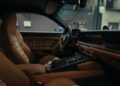 The interior of a luxury Porsche car featuring brown leather and plaid fabric seats, a modern dashboard, and various controls is showcased in a garage setting—perfect for a Sonderwunsch video series.