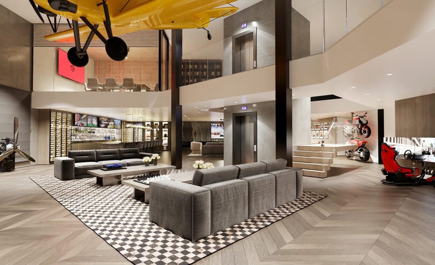 Modern lounge with gray sofas, checkered rug, and state-of-the-art storage shelves; features a yellow plane hanging from the ceiling like a Hangar, plus a motorbike and red racing simulator.