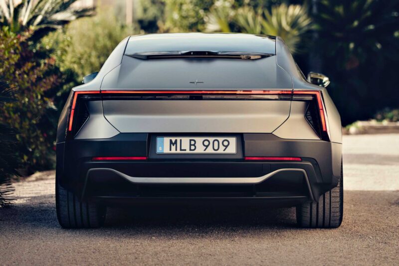 Rear view of a silver electric car parked on a road, featuring sleek tail lights and a Swedish license plate "MLB 909"—the Polestar 5 debuts at IAA 2025 as the brand’s first true flagship EV GT.