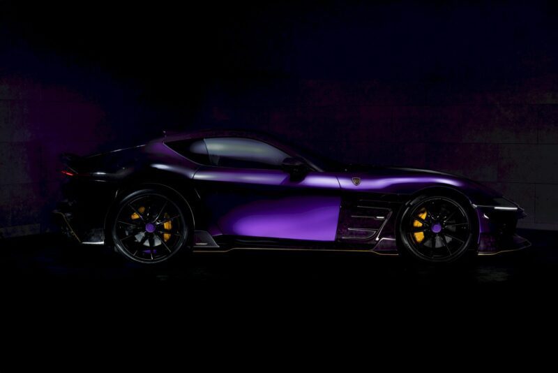 A sleek, dark purple sports car with black wheels and yellow brake calipers, reminiscent of the MANSORY Previews Ferrari 12Cilindri-based Equestre ahead of Monaco Yacht Show, is positioned in profile against a dark background.