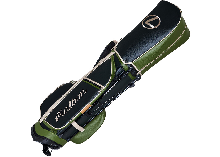 Green and black golf bag with white trim, part of the Malbon Golf x Lexus Capsule Collection, featuring the Lexus logo and "malbon" branding, shown at an angle.