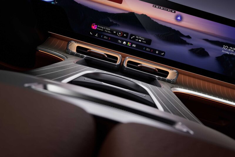 View of a modern Mercedes car interior featuring a 39-Inch Hyperscreen digital dashboard, dual air vents, and ambient lighting in the all-electric GLC.