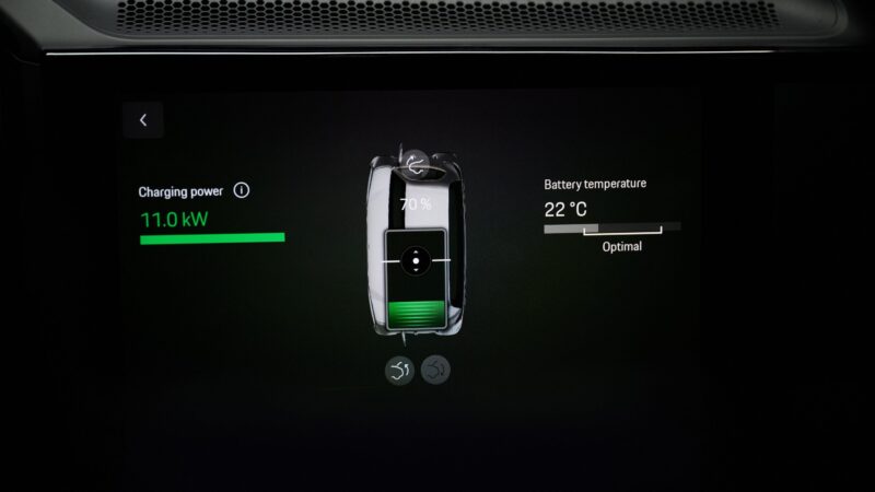 A digital display shows an electric vehicle battery charging at 11.0 kW, with 70% charge and a battery temperature of 22°C—labeled as optimal. Porsche to Highlight Wireless Charging on Upcoming Cayenne Electric at IAA 2025.