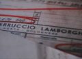 A close-up of a document featuring the name "Ferruccio Lamborghini," with handwritten red markings highlighting sections of the text, captures a piece of Lamborghini history preserved by Polo Storico.