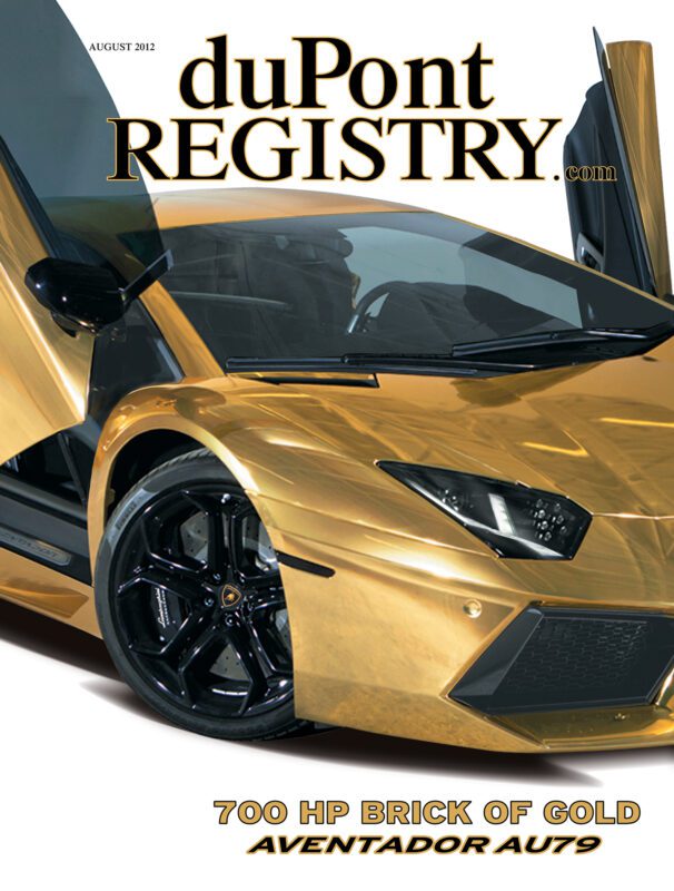 A gold Lamborghini Aventador with scissor doors open is featured on the August 2012 duPont REGISTRY Cover Cars issue. Text reads "700 HP BRICK OF GOLD AVENTADOR AU79.”.