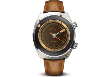 A wristwatch with a brown leather strap, a round silver case, and a brown and gold dial displaying time and “FIFTEEN PULSATION SCALE” markings—perfect for those who appreciate the best luxury watches.