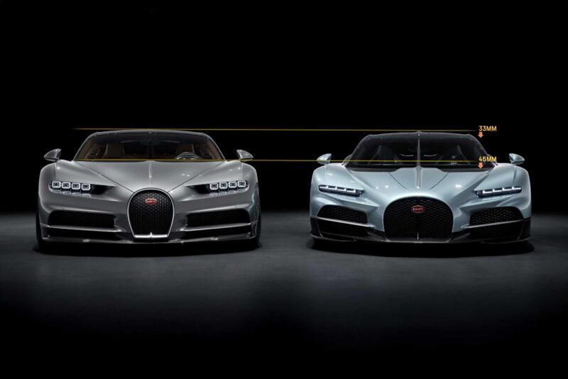 Two Bugatti sports cars, including the Bugatti Tourbillon, are parked side by side in a dark studio. Yellow lines and measurements highlight differences in height and width between the two vehicles, showcasing their evolution and history.