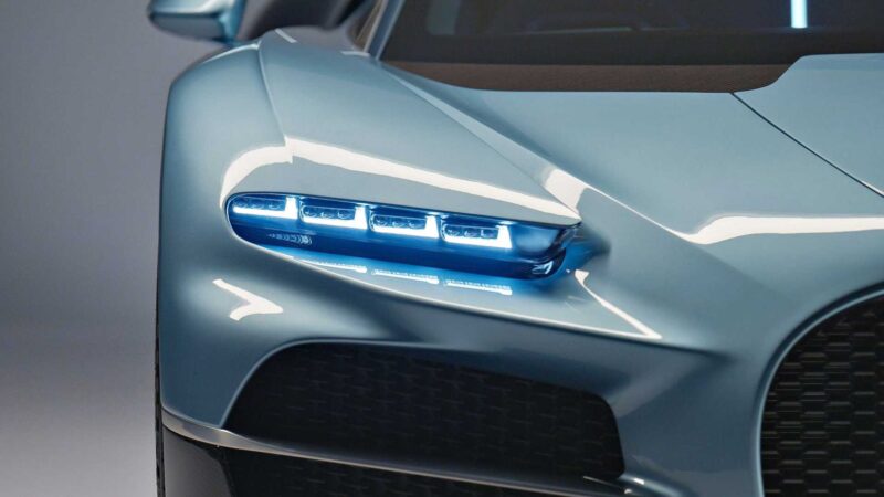 Close-up of the front left headlight of a light blue sports car, showcasing multiple LED elements and part of the grille—echoing how form and function unite, as seen in How Form Function Past and the Future Came Together in the Bugatti Tourbillon.